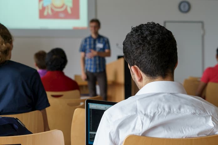 speaking in front of students in classroom